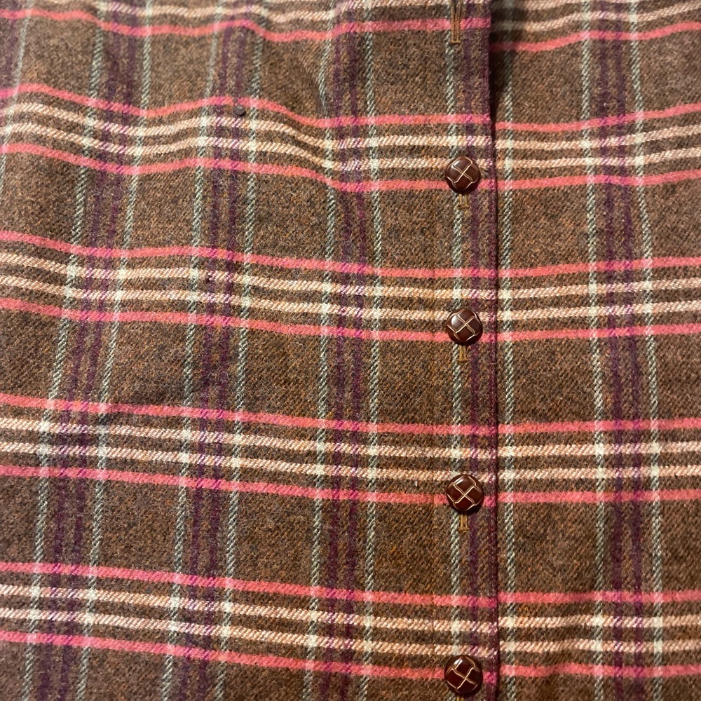 Wool short button front skirt. Fully lined.  Never worn.  Elastic side inset